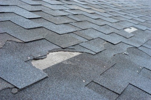 broken roof in need of replacement