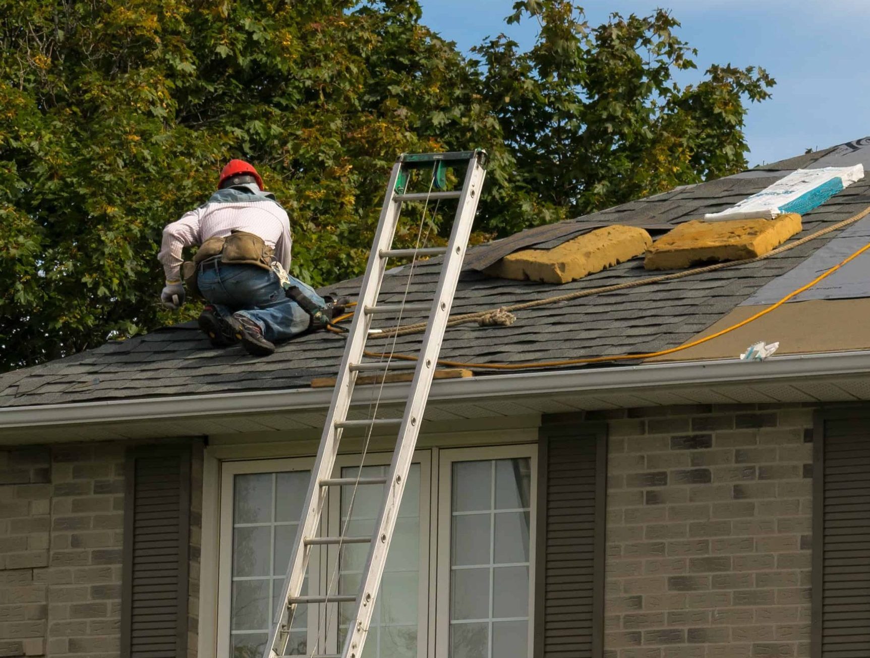 roofing expert inspecting leaking roof at an ottawa house